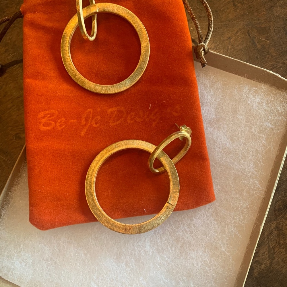 Be Jo gold earrings. New in bag/box.